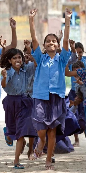 A group of girls celebrating joyfully outdoors