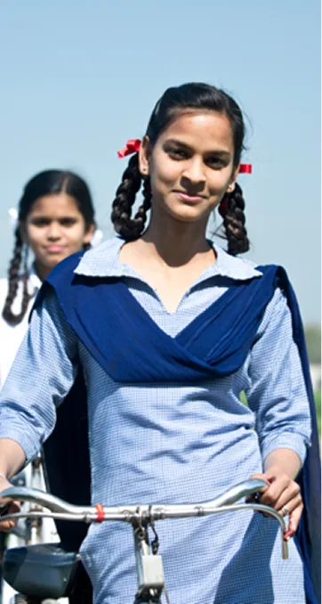 A girl riding a bicycle with confidence